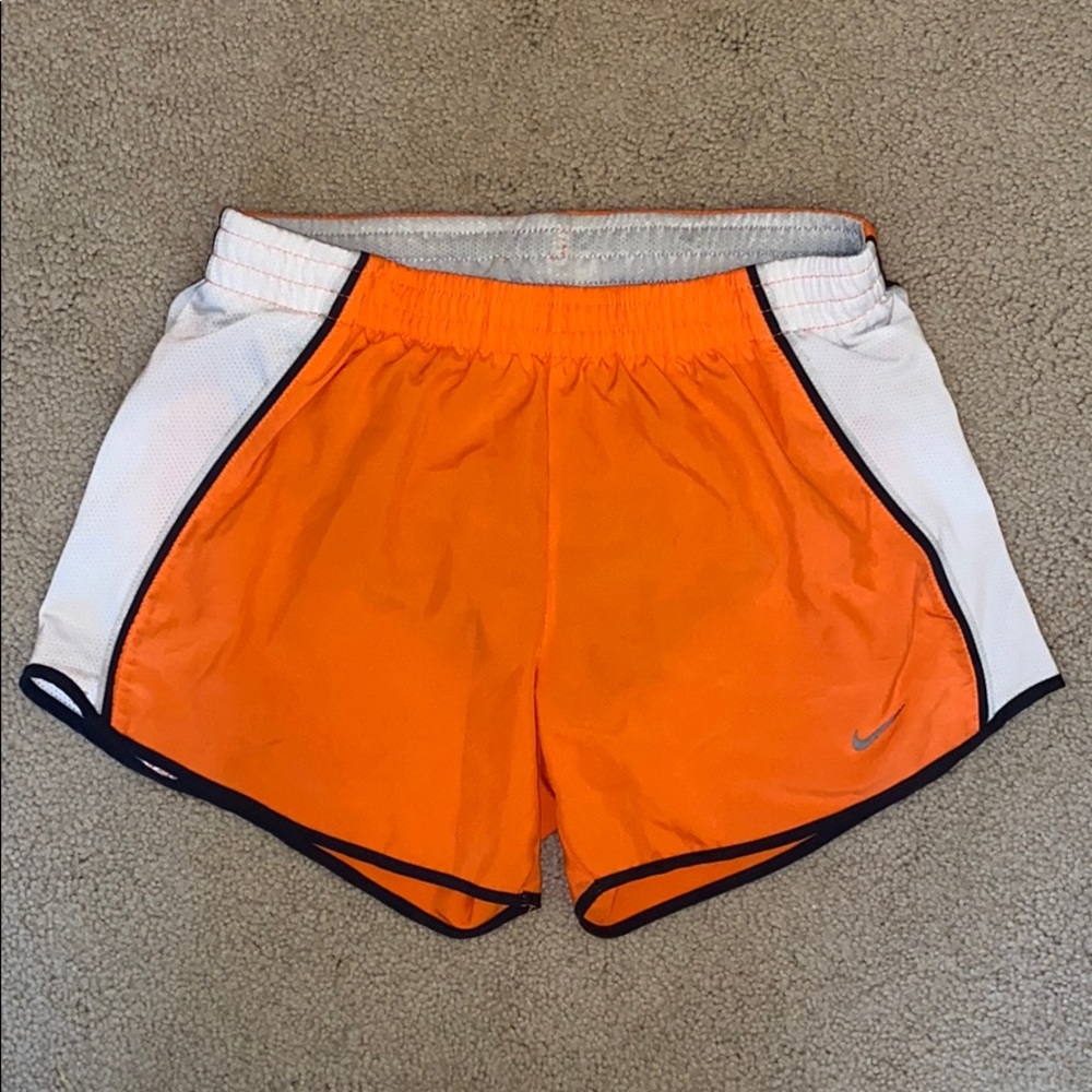 Orange Nike women’s running shorts
